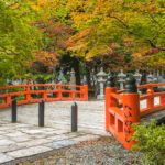 Red bridge amongst green trees in Koyasan