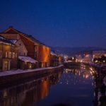 Light reflecting on canal at night in Otaru